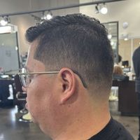 Faux hawk with a high fade